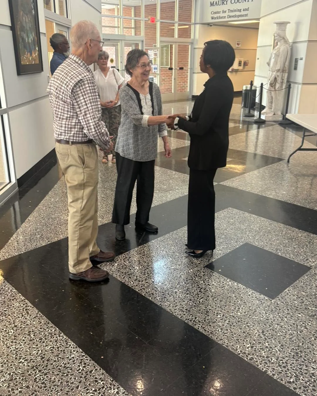 Ashley greeting community members · Photo shared September 22, 2026 photo 1